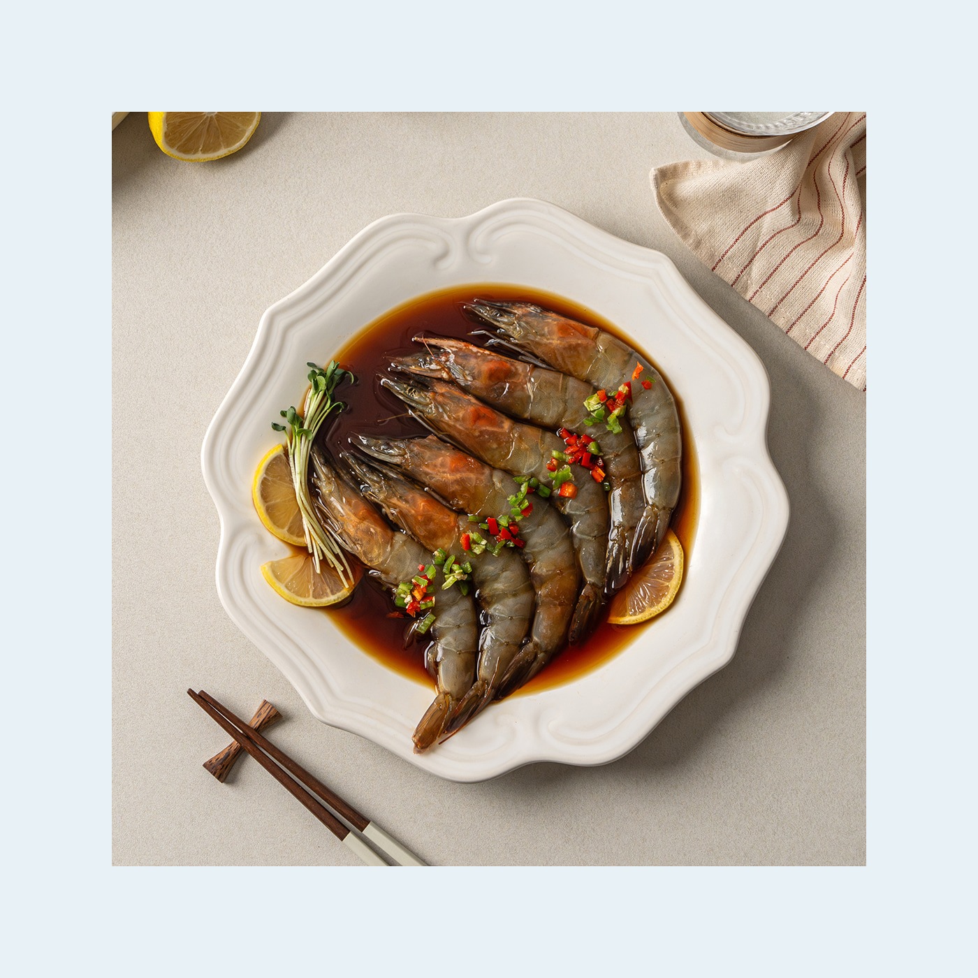 Soy-marinated shrimp on a scalloped white plate