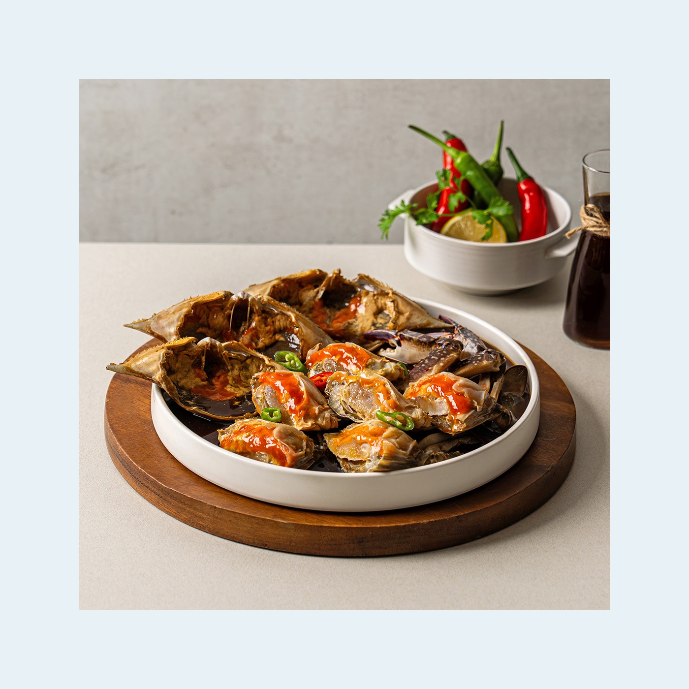 Soy-marinated crab with full roe served in a white bowl